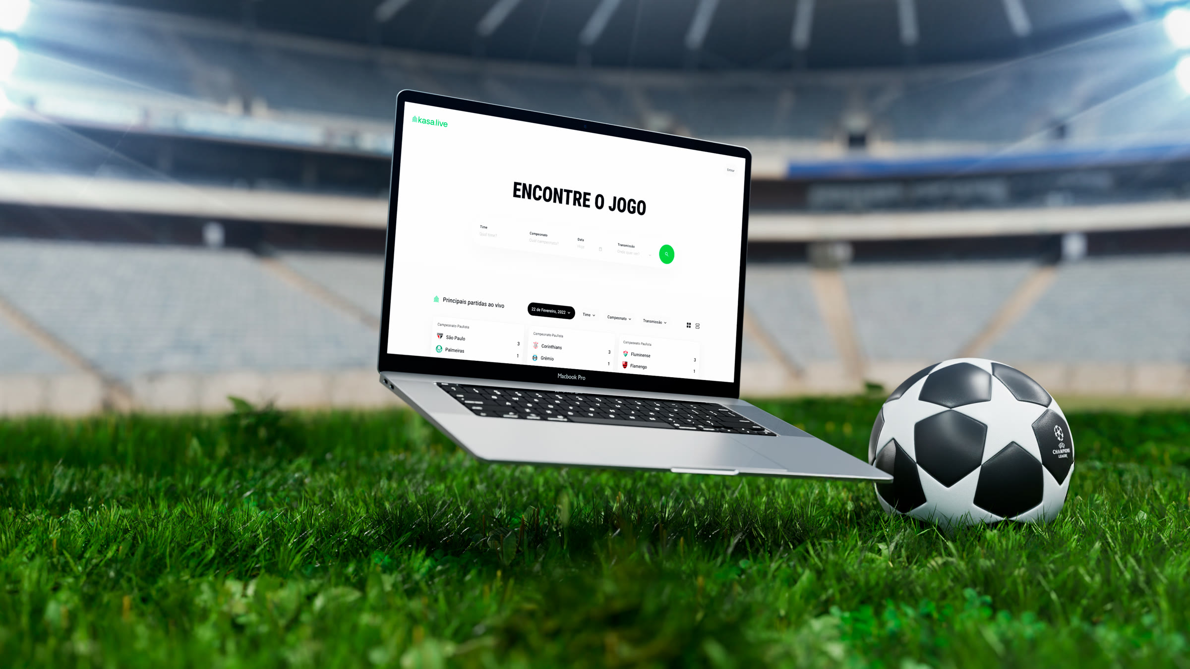Open laptop on a stadium pitch showing the kasa.live Encontre o Jogo screen with its team, championship and date filters, a football beside it